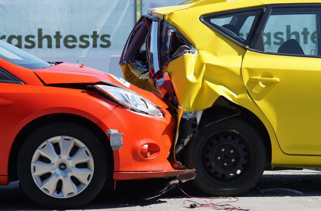 Rear-End Car Crash Between Yellow And Red Cars