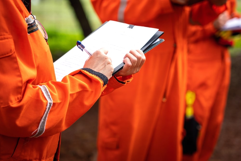 Paramedics Filling Out Documents