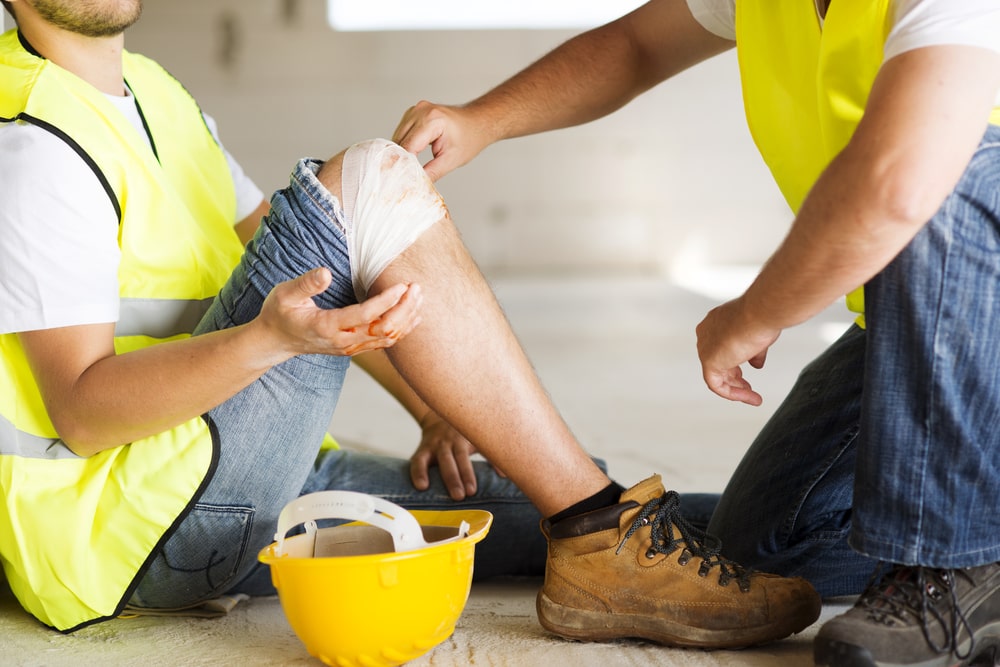 Construction Worker With A Bandages Knee