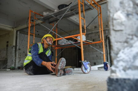 Construction Worker With Injured Leg